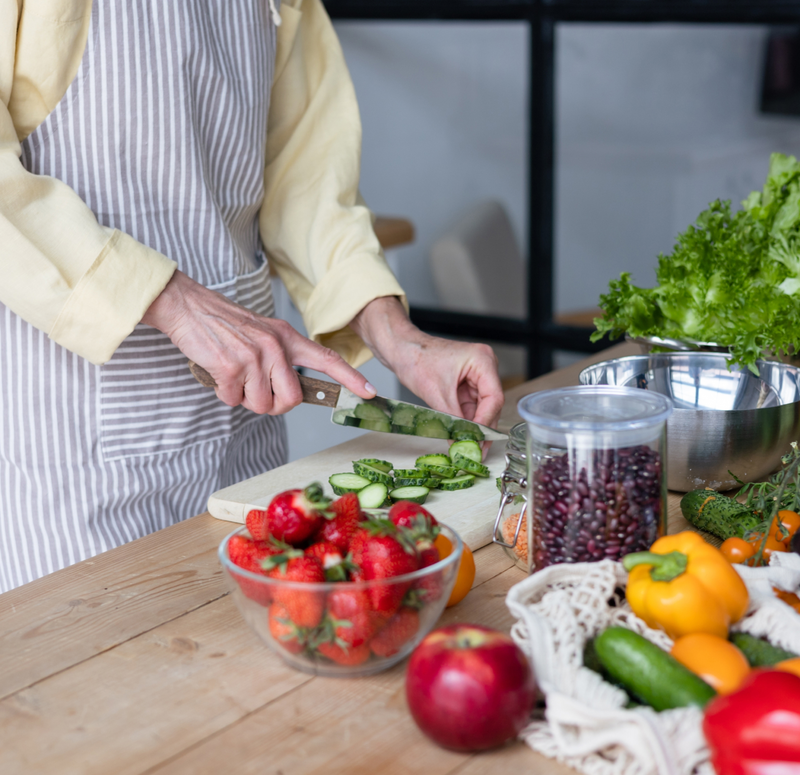 woman cutting vegetables