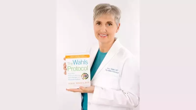 Terry Wahls holding The Wahls Protocol