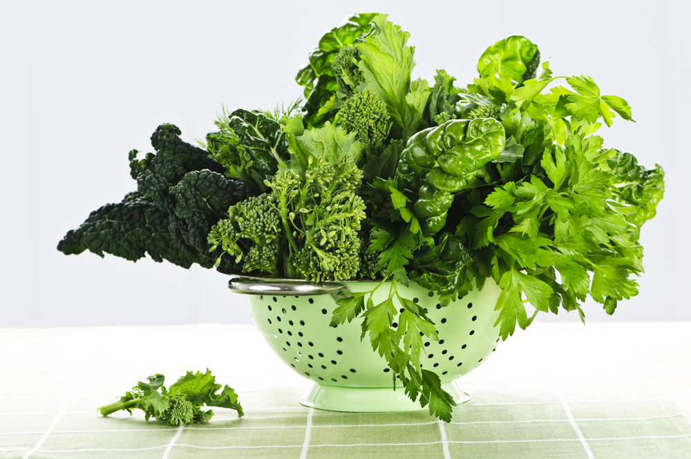 colander filled with leafy greens